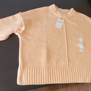 Yellow long sleeve knit sweater in NEW condition.